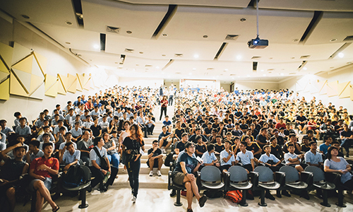 People sitting in an auditorium for an event